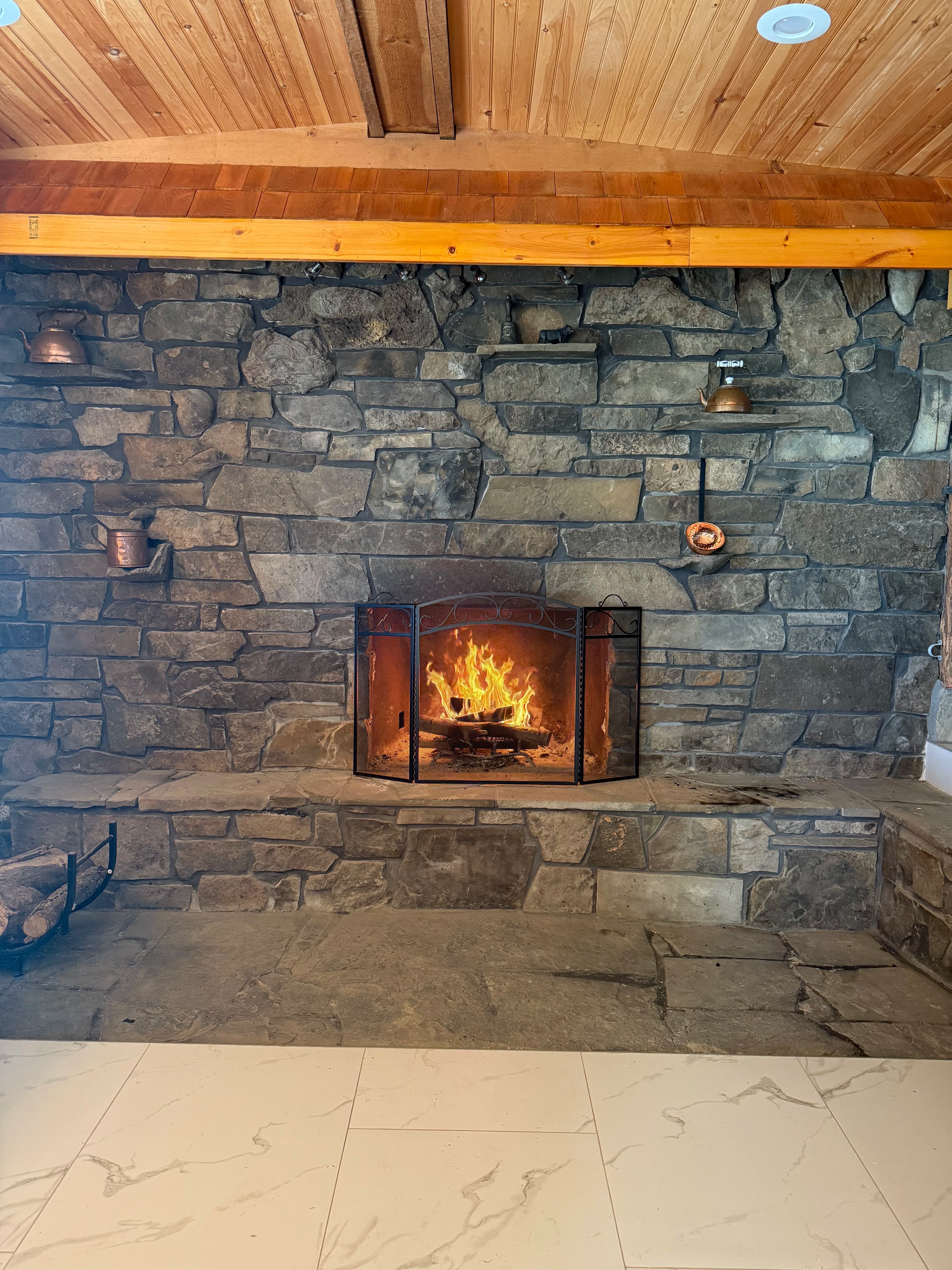 Rustic stone fireplace with warm ambiance