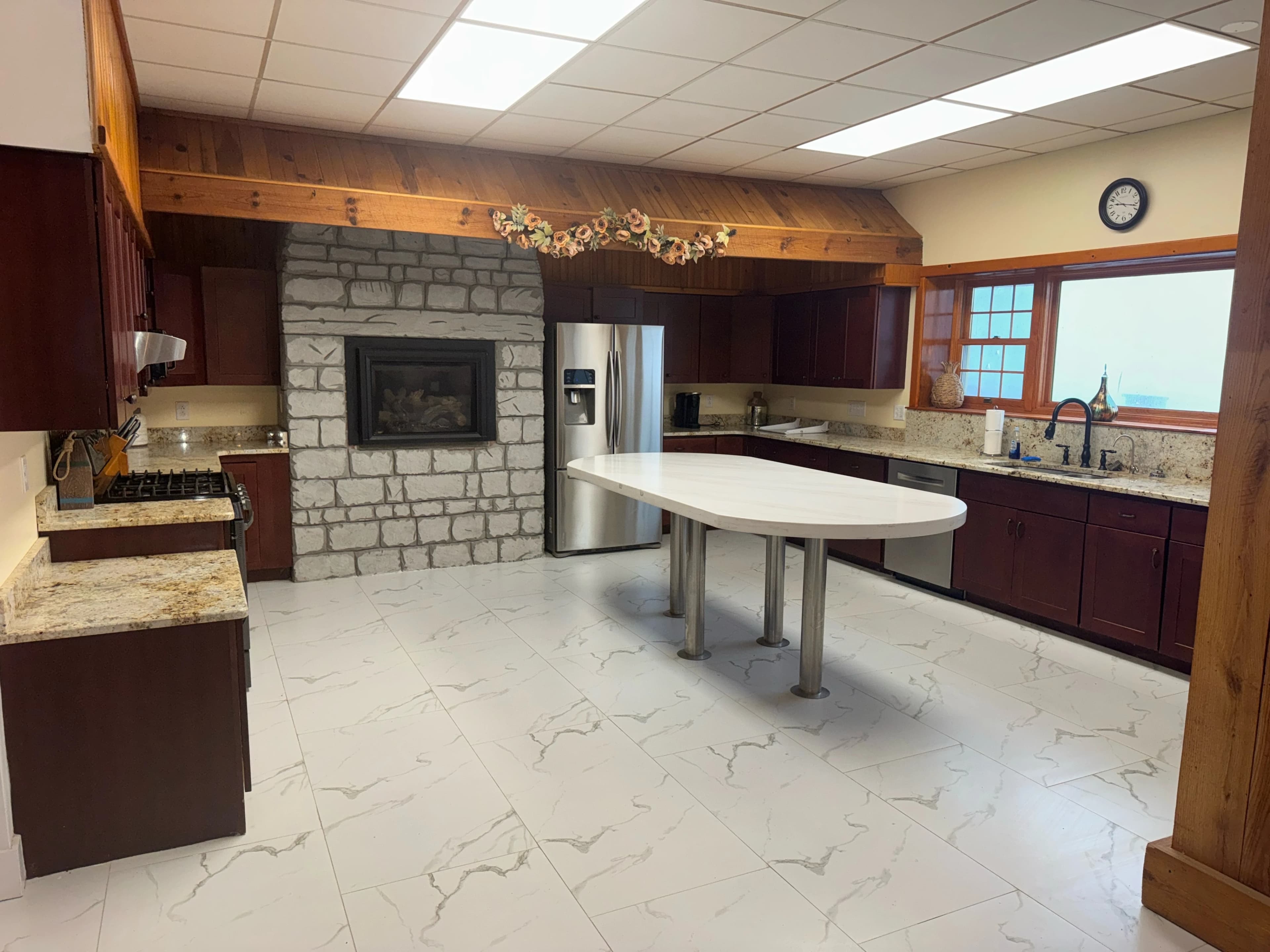 Commercial kitchen with stone fireplace